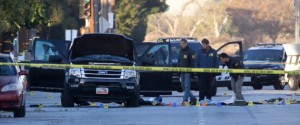 Authorities investigate the scene where a police shootout with suspects took place, Thursday, Dec. 3, 2015, in San Bernardino, Calif.  A heavily armed man and woman opened fire Wednesday on a holiday banquet, killing multiple people and seriously wounding others in a precision assault, authorities said. Hours later, they died in a shootout with police.  (AP Photo/Jae C. Hong)